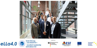 Group photo of the project "eLLa4.0 - Sociodigital Transformation towards Excellent Leadership and Labour" at a staircase of the Social Research Centre.