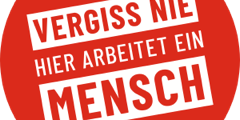 Grafik: Roter Kreis mit weißer Schrift "VERGISS NIW HIER ARBEITET EIN MENSCH"